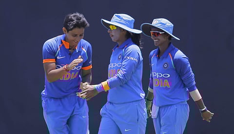 India's bowler Mansi Joshi, left, celebrates the dismissal of Sri Lanka's Sripali Weerakkody with captain Mithali Raj, center, during their first one day international women's cricket match in Galle. (Photo | AP)