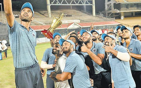 Vijay CC players celebrate their VAP Trophy triumph on Monday | D SAMPATHKUMAR