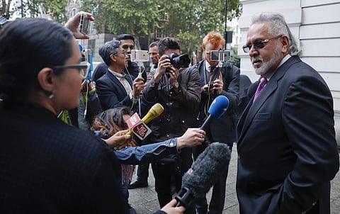 F1 Force India team boss Vijay Mallya speaks to the media outside Westminster Magistrates Court during a break for lunch as he attends a hearing at the court in London, Wednesday, Sept. 12, 2018.  | AP