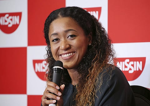 US Open women's singles champion Naomi Osaka smiles during a press conference in Yokohama, Japan | AP