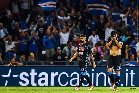 Napoli's Elseid Hysaj and Raul Albiol, left, walk in dejection on the pitch after Sampdoria's Fabio Quagliarella scored during a Serie A match (File | AP)