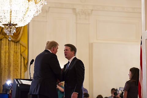 President Donald Trump shakes hands with Brett Kavanaugh, his Supreme Court nominee. (Photo | AP)