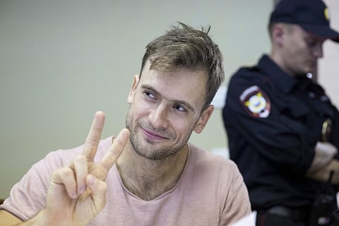 In this file photo taken on Monday, July 23, 2018, Pyotr Verzilov, a member of the feminist protest group Pussy Riot, gestures during hearings in a court in Moscow, Russia. | Associated Press