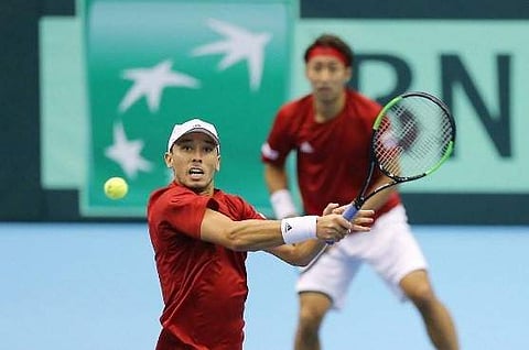 Ben McLachlan (Front) and Yasutaka Uchiyama thrashed Tomislav Brkic and Nerman Fatic 6-2, 6-4, 6-4. | AFP