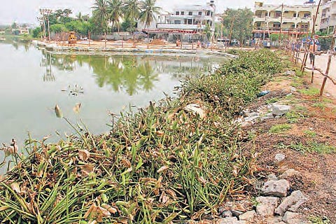 An earthmover at work at Kapra lake, on Friday | Sathya Keerthi