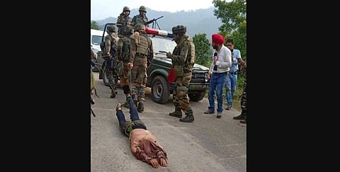 Picture of army men dragging body of slain JeM militant with chains that went viral social media. (Photo | Twitter)