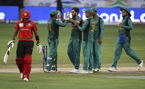 Pakistan's Usman Khan (without cap) celebrates with teammates the dismissal of Hong Kong's Tanvir Afzal | AP
