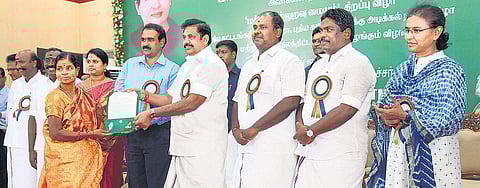 Chief Minister Edappadi K Palaniswami handing over welfare assistance to a beneficiary at Kancheepuram Collectorate on Saturday | Express