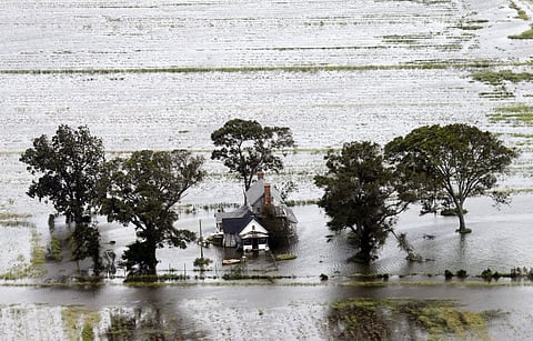 A farm house is surrounded by flooded fields from tropical storm Florence in Hyde County, N.C., Saturday, Sept. 15, 2018. (Photo | AP)