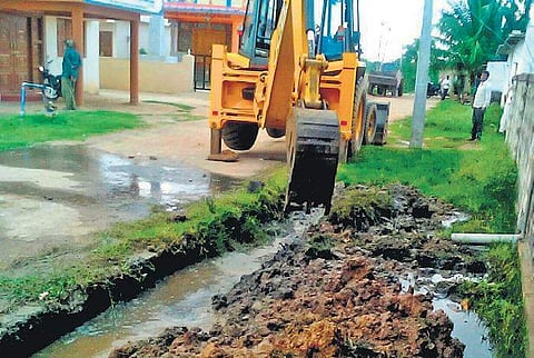 Work on underground drainage in progress near pre-matric girls hostel in Mangalore in Yelburga taluk in Koppal district