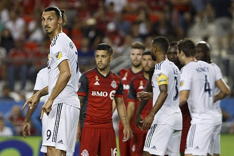 Los Angeles Galaxy forward Zlatan Ibrahimovic gets ready to defend a free kick during the second half of an MLS soccer game against Toronto FC. | AP