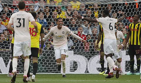 Manchester United's Chris Smalling, centre, celebrates after scoring his side's second goal during the EPL match against Watford at Vicarage Road stadium. | AP