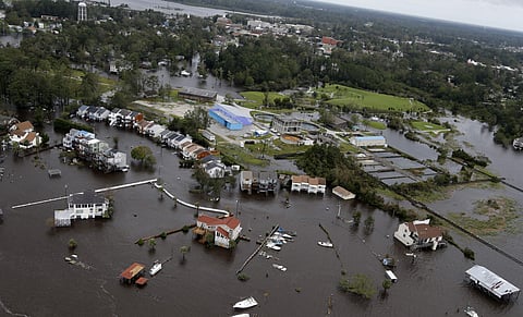 Homes and a marina are flooded as a result of high tides and rain from hurricane Florence which moved through the area in Jacksonville, N.C., Sunday, Sept. 16, 2018. | AP
