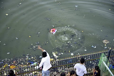 People immersing Ganesh Idol at Hussain sagar lake in Hyderabad (Photo | Express)