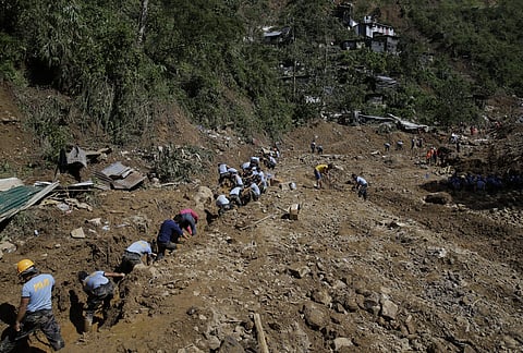 Rescuers continue to search for victims buried by a landslide after Typhoon Mangkhut lashed Itogon, Benguet province, northern Philippines. ( Photo | AP )