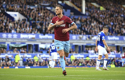 West Ham United's Marko Arnautovic celebrates scoring his side's third goal of the game, during the English Premier League soccer match between Everton and West Ham United, at Goodison Park, Liverpool, England, Sunday Sept. 16, 2018. | AP