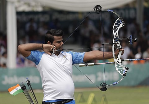 India's Rajat Chauhan competes during the archery compound men's team match against South Korea at the 18th Asian Games in Jakarta. (Photo | AP)