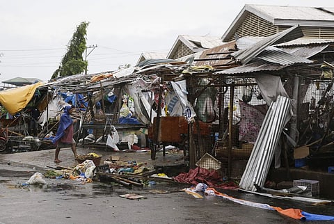 A resident looks at market stalls destroyed by strong winds as Typhoon Mangkhut barreled across Tuguegrao city in Cagayan province, northeastern Philippines. (Photo | AP)