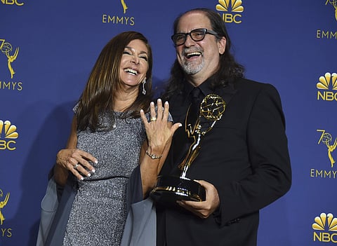 Glenn Weiss, right, winner of the award for outstanding directing for a variety special for 'The Oscars' and Jan Svendsen pose in the press room after getting engaged at the 70th Primetime Emmy Awards. (Photo: AP)