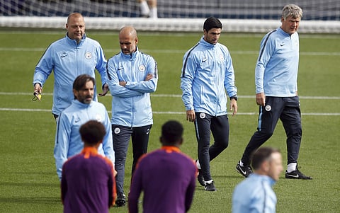 Manchester City coaching staff, from left, Rodolfo Borrello, manager Pep Guardiola, Mikel Arteta and Brian Kidd attend a training session at the City Football Academy | AP