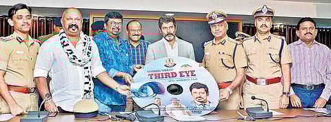 Police commissioner A K Viswanathan along with actor Vikram releasing a video for spreading awareness on installing CCTVs on Monday | Express