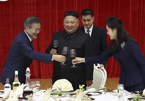 South Korean President Moon Jae-in, left, toasts with North Korean leader Kim Jong-un and his wife Ri Sol Ju during a welcome banquet in Pyongyang, North Korea. (Photo | AP)
