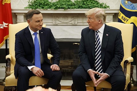 President Donald Trump talks with Polish President Andrzej Duda during a meeting in the Oval Office of the White House | AP