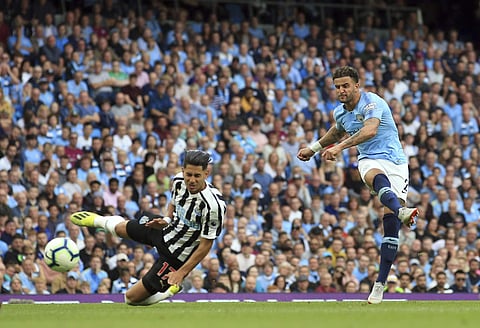 Manchester City's Kyle Walker, right, scores his side's second goal during the English Premier League soccer match between Manchester City and Newcastle United at the Etihad Stadium in Manchester, England, Saturday, Sept. 1, 2018. | AP