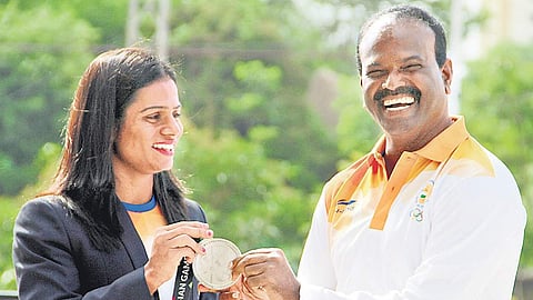 Coach Ramesh Nagapuri with athlete Dutee Chand