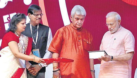 Prime Minister Narendra Modi, along with Telecom Minister Manoj Sinha, launches the India Post Payments Bank in New Delhi on Saturday (Photo | Shekhar Yadav)