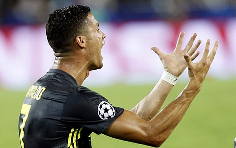 Juventus forward Cristiano Ronaldo reacts after receiving a red card during the Champions League match against Valencia | AP