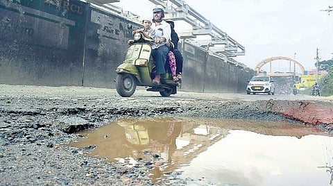 A big crater on the busy Mysuru Road near Kengeri BMTC bus stand poses a threat to motorists and pedestrians | PANDARINATH B