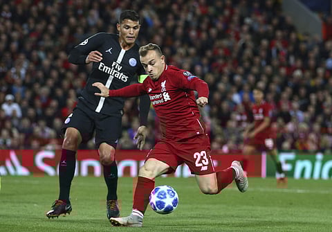 Liverpool's Xherdan Shaqiri, right, vies for the ball with PSG's Thiago Silva during the Champions League Group C soccer match between Liverpool and Paris-Saint-Germain at Anfield stadium in Liverpool, England, Tuesday, Sept. 18, 2018. | AP