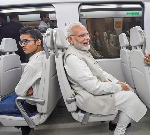 Avoiding traffic jams and inconvenience to motorists, Prime Minister Narendra Modi on Thursday chose to take a Metro ride to reach Dwarka near Indira Gandhi International Airport. (Photo | PTI)
