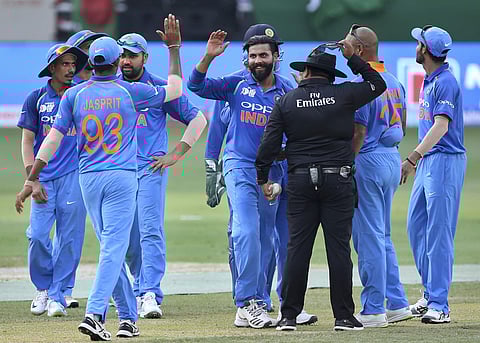 Ravindra Jadeja celebrates with teammates the dismissal of Bangladesh's Mushfiqur Rahim during the Asia Cup match (Photo | AP)