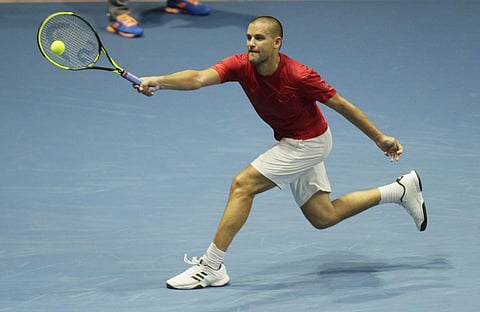 Mikhail Youzhny of Russia returns the ball to Roberto Bautista of Spain during the St. Petersburg Open. (Photo | AP)