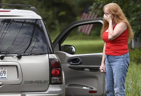 Shirley Pollack, of Perryville, Md. reacts to what authorities have called a shooting with multiple victims in Perryman, Md. on Thursday, Sept. 20, 2018. Authorities say multiple people have been shot in northeast Maryland in what the FBI is describing as