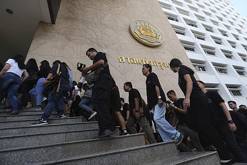 Plaintiffs of Ford cars with bad transmissions walk to inside civil court before a verdict in a class-action lawsuit in Bangkok, Thailand.( Photo | AP)