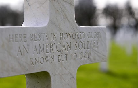 FILE - In this March 24, 2017 file photo, a gravestone marker for an unknown American soldier sits in the rows crosses at the Meuse-Argonne American cemetery in Romagne-sous-Montfaucon, France. It was America's largest and deadliest battle ever, with 26,0