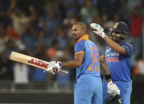 India's captain Rohit Sharma, right, congratulates teammate Shikhar Dhawan on scoring a century during the one day international cricket match of Asia Cup between India and Pakistan in Dubai. (Photo | AP)