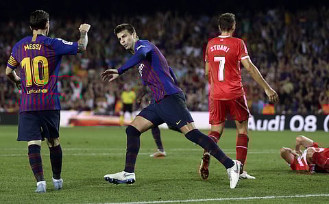 FC Barcelona's Gerard Pique celebrates with his teammate Lionel Messi after scoring during the Spanish La Liga  match against Girona | AP