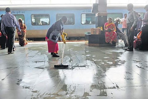 Railway workers cleaning the station premises and railway tracks of Kachiguda railway station | Sathya keerthi