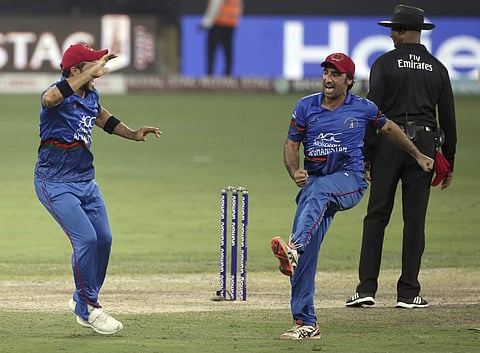 Afghanistan's captain Asghar Afghan, second right, celebrates the dismissal of India's last wicket of Ravindra Jadeja during the one day international cricket match of Asia Cup between India and Afghanistan in Dubai. (Photo | AP)