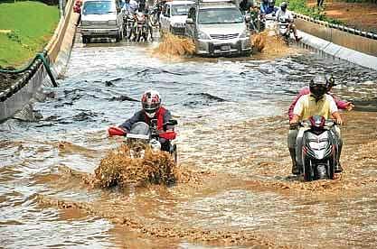 Vehicles wade through water-logged road under Hebbal flyover in Bengaluru on Tuesday | Express