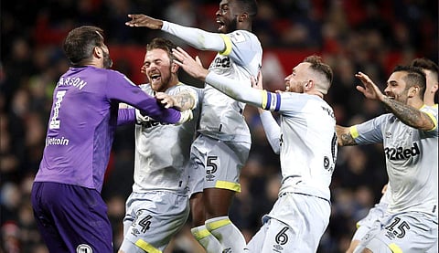 Derby County players celebrate defeating Manchester United in English League Cup (Photo | Twitter/Derby County)