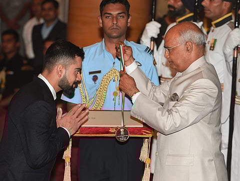 Indian cricket team captain Virat Kohli sent the shutterbugs into a clicking frenzy as he received the Rajiv Gandhi Khel Ratna award, the country's highest sporting honour  at the National Sports and Adventure Award 2018 function at Rashtrapti Bhawan in N
