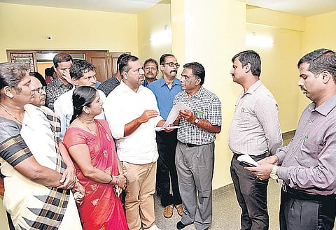 Minister U T Khader in talks during the inauguration of ‘A’ Grade officers housing building in Mangaluru on Wednesday  | Rajesh Shetty Ballalbagh