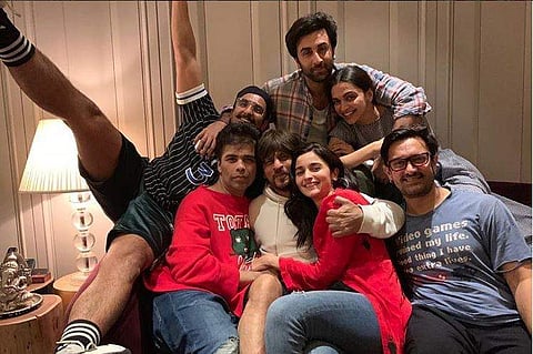 Taking to his Instagram, the director-producer shared a snap of Bollywood A-listers Shah Rukh Khan, Aamir Khan, Alia Bhatt, Ranbir Kapoor, Deepika Padukone, Ranveer Singh and himself sitting on a sofa, captioned 'The biggest BLOCKBUSTER ever!!!!!' (Photo: