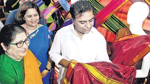 Minister for Municipal Administration and Urban Development K T Rama Rao checks the quality of Bathukamma sarees at the Commissioner and Director of Municipal Administration Office at Masab Tank,  in Hyderabad on Thursday  | sathya keerthi