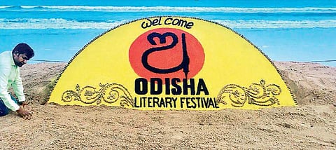 Renowned artist Sudarshan Patnaik with his sand sculpture on Odisha Literary Festival-2018 at  Puri beach on the eve of the event on Friday | Express